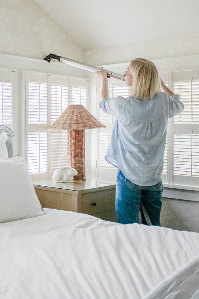 vacuum dusting window ledge